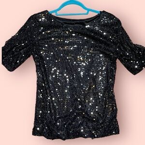 “Black Sequin Shirt: Perfect for 70s Disco Vibes or Futuristic Trekkie Fashion”